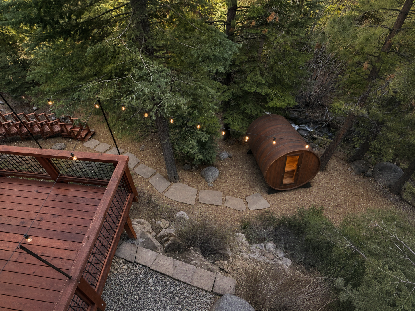 Aerial view of the new outdoor sauna and creekside deck at 623 Tyner Way